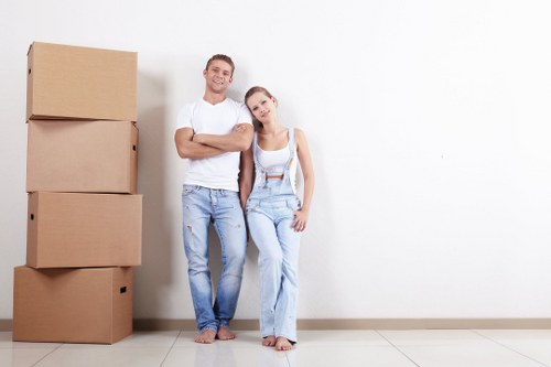 Movers loading furniture for a Clerkenwell home move on a city street