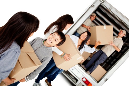 House movers assisting a Clerkenwell flat move with boxes and furniture