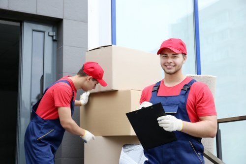 Furniture and boxes being loaded into a removals van