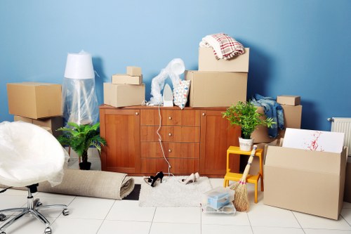 Careful wrapping of fragile household items for a move in Clerkenwell