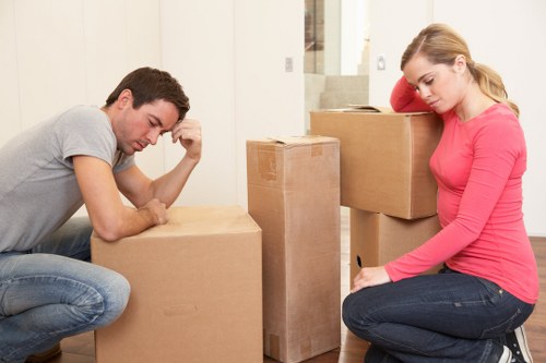 Workers securing furniture and equipment for transport