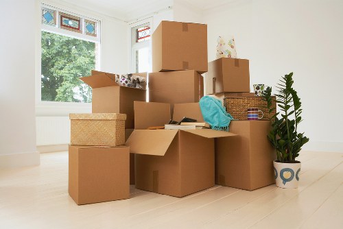 Local office movers handling equipment in a central London building